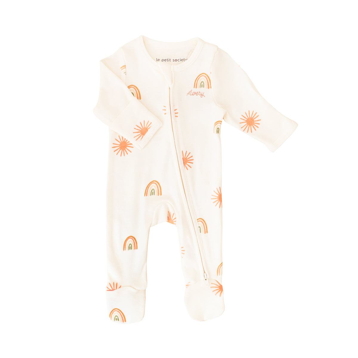 A baby organic zip sleepsuit with foldable mittens and footies by Le Petit Society, featuring a print of sun and rainbows over a cream base. 