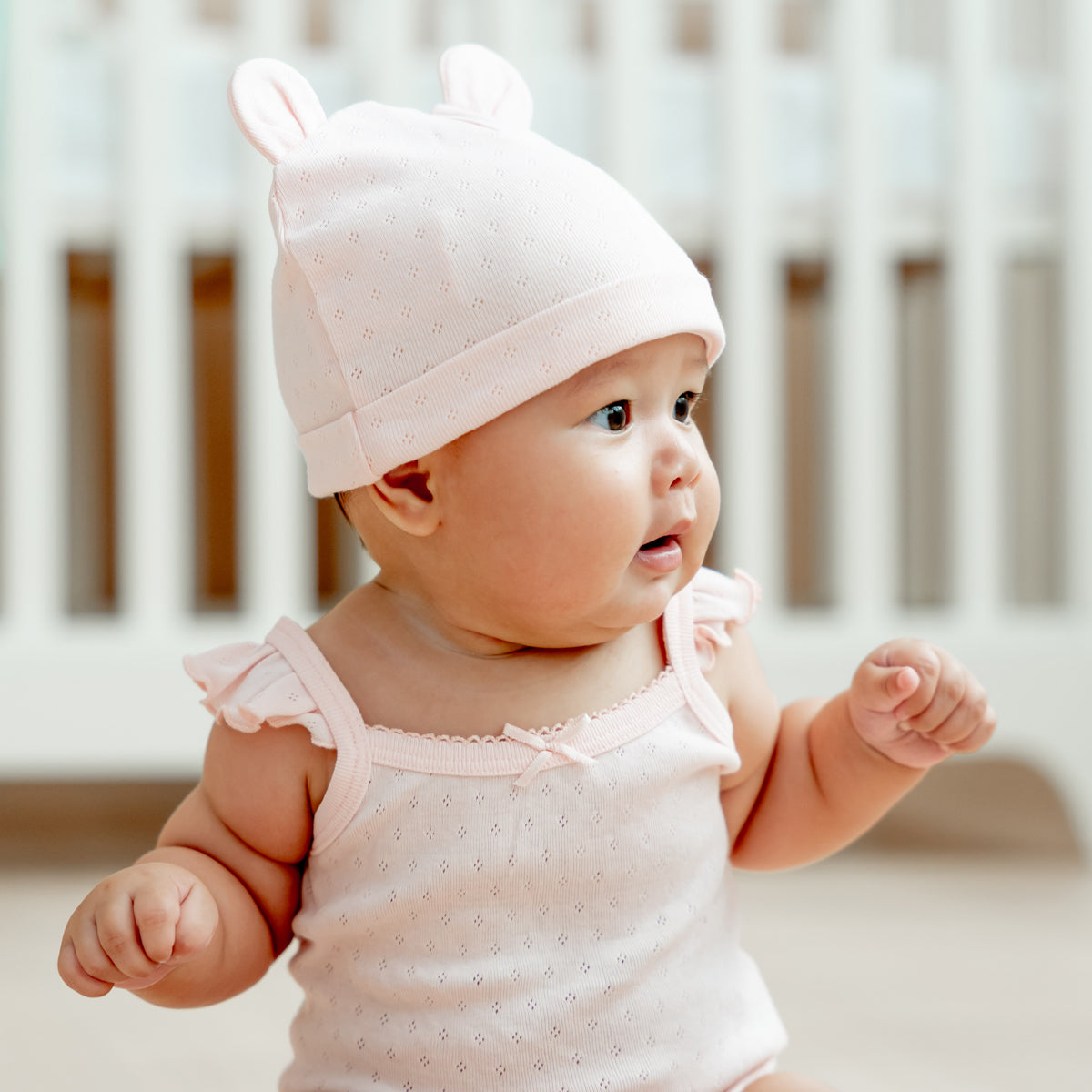 Organic Baby Ruffle Strap Romper in Pink by Le Petit Society — image 2