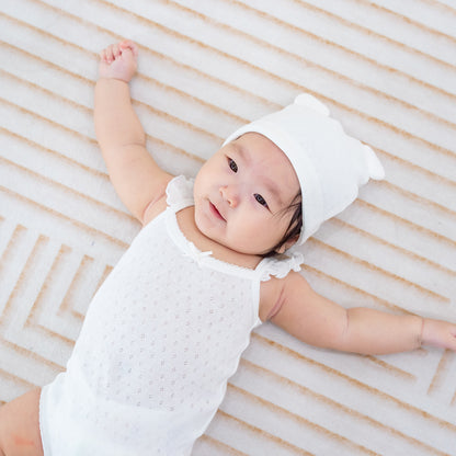 Organic Baby Ruffle Strap Romper in White by Le Petit Society — image 11