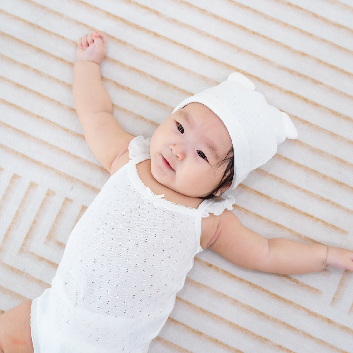 Organic Baby Ruffle Strap Romper in White by Le Petit Society