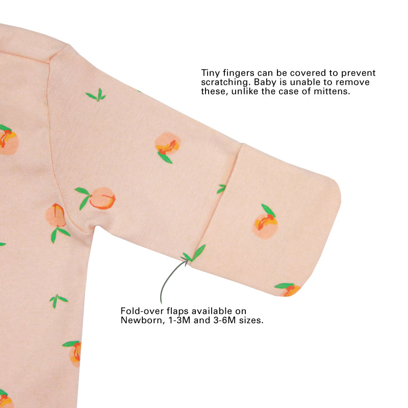 An infographic showing the mittens of an organic baby zip sleepsuit, which come with fold over flaps to cover a baby's hands and keep them warm.
