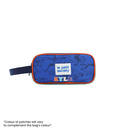 A blue and orange pencil in dinosaur print, and personalised with name patches.