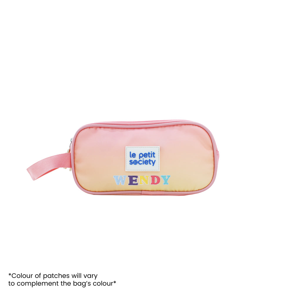 Le Petit Society's pink and yellow gradient pencil case with personalised name patches.