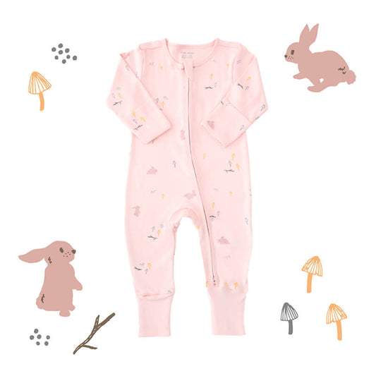 An organic pink baby zip sleepsuit from Le Petit Society. It comes with a print of rabbits, mushrooms and wood sticks, as well asfoldable mittens and footies.