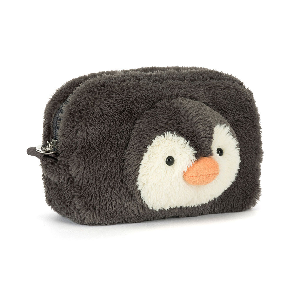 A 45 degree view of a cute penguin-shaped plush pouch with soft grey fur and an orange beak. Features a white belly, black eyes, and a zipper closure.