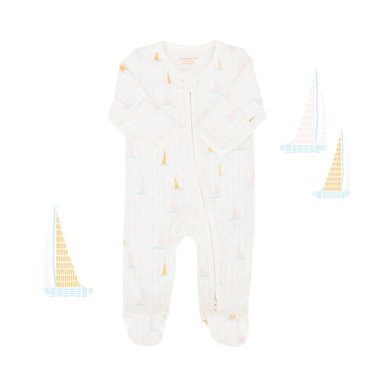 An organic baby zip sleepsuit from Le Petit Society. It is white in colour with a print of sail boats and foldable mittens and footies.