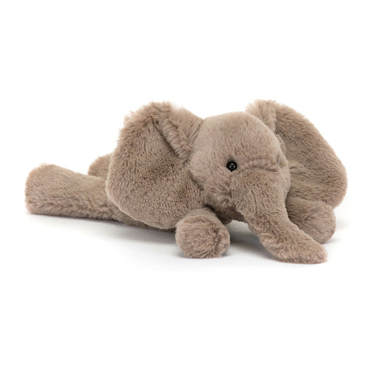 A 45 degree view of a tiny soft plush elephant toy in light brown with floppy ears and long trunk. Adorable and huggable stuffed animal, perfect for kids, nursery décor, or as a cuddly gift