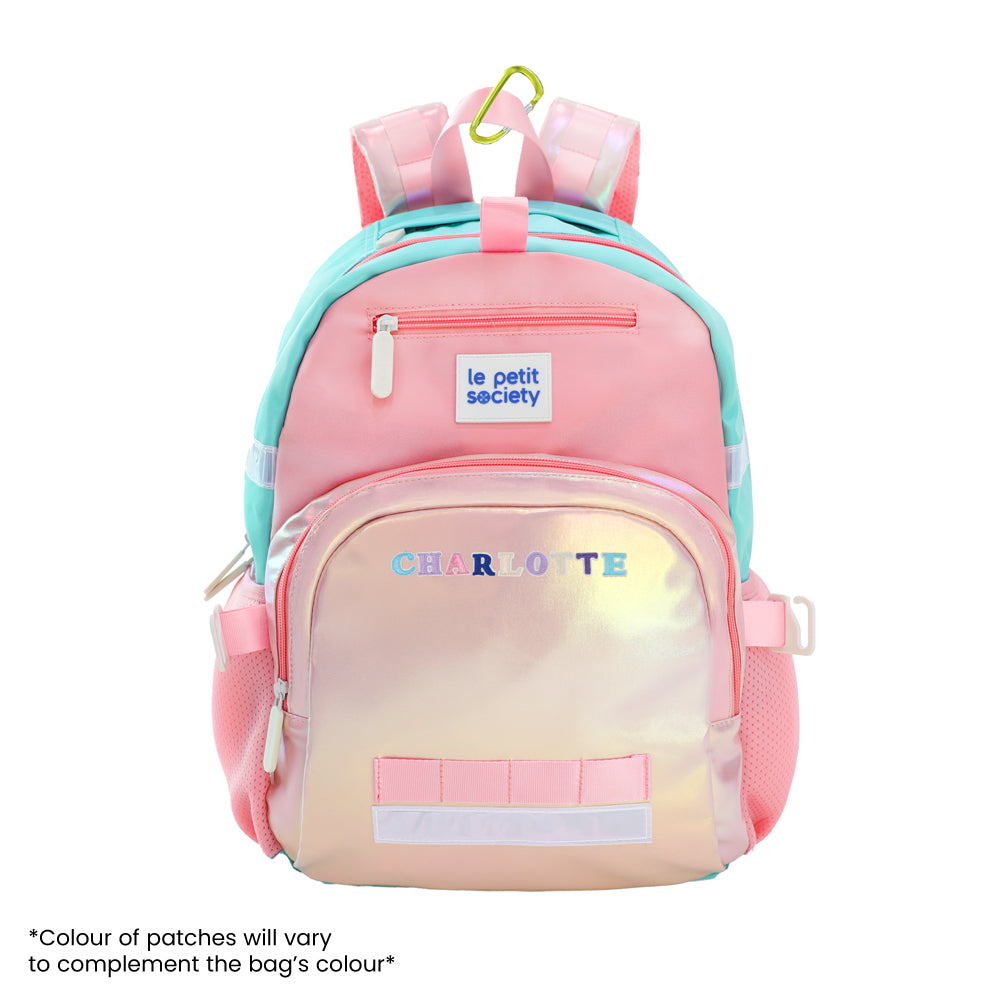 The LPS kids single pocket school bag with an iridescent pink and gold design and personalised name patches.