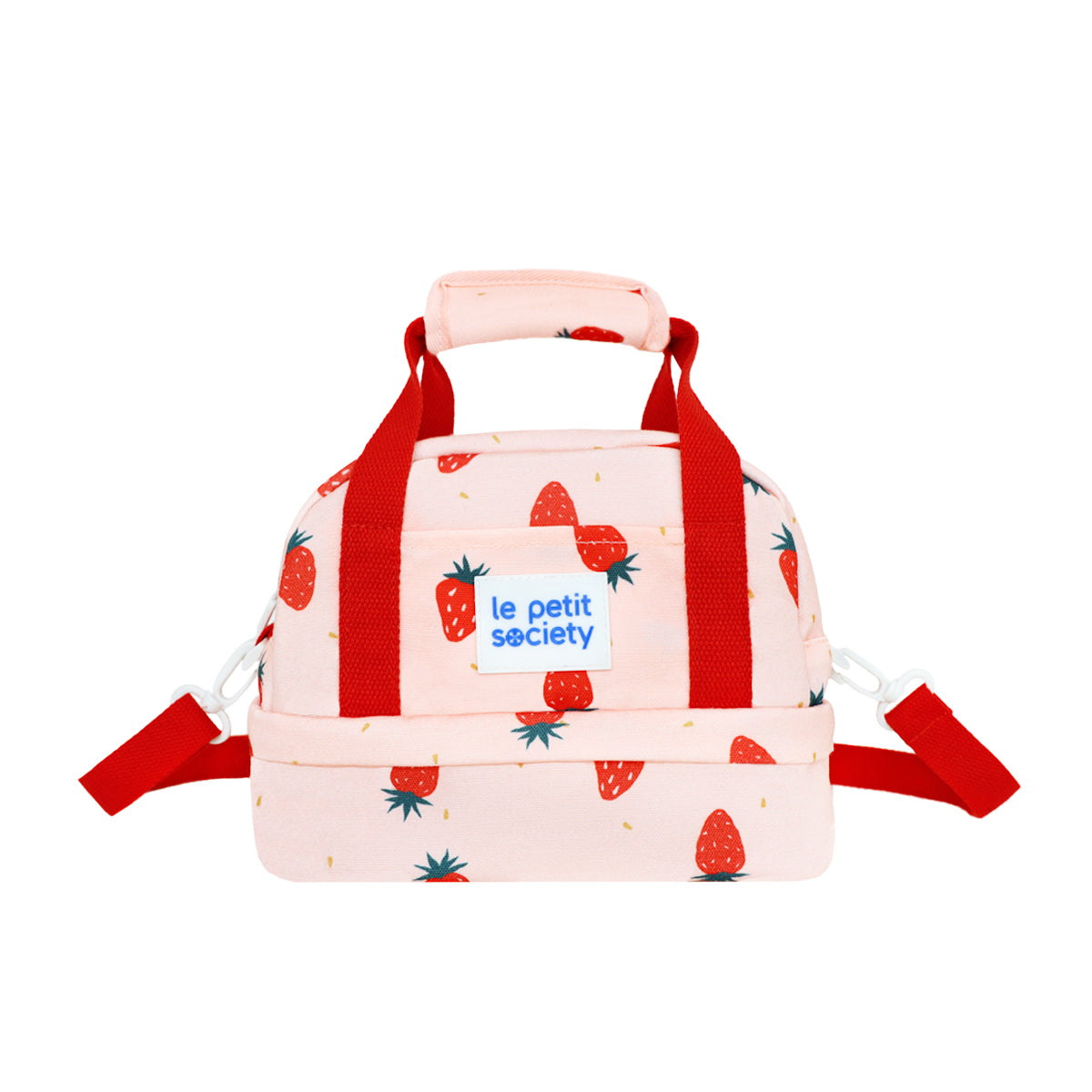 Le Petit Society's kid's thermal lunch bag in pink, with a strawberry print and red straps.