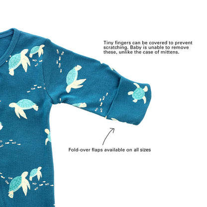 An infographic showing the mittens of an organic baby zip sleepsuit, which come with fold over flaps to cover a baby's hands and keep them warm.