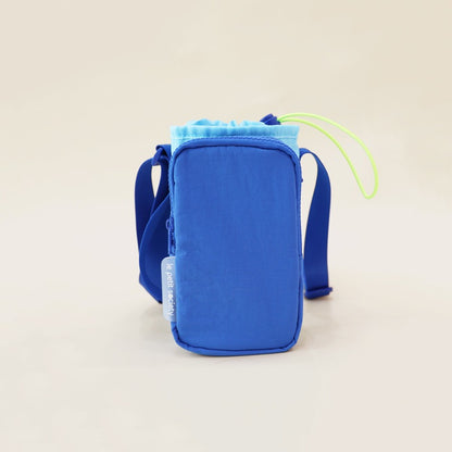 Kids water bottle sling bag in sky and dark blue with adjustable strap and front pocket