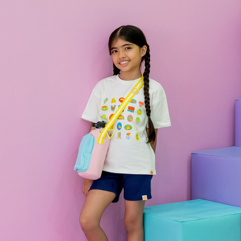 Little girl carrying a water bottle sling bag.