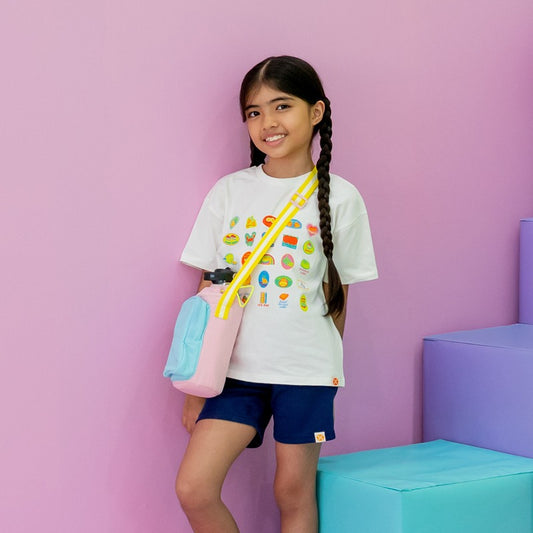 Little girl carrying a water bottle sling bag.