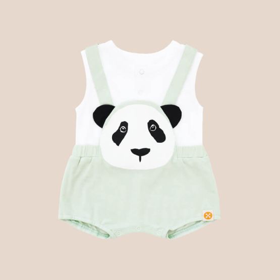 An animal-themed baby romper by Le Petit Society, featuring a panda's face at the front, complete with mint green bottoms and cross back straps over a white base.