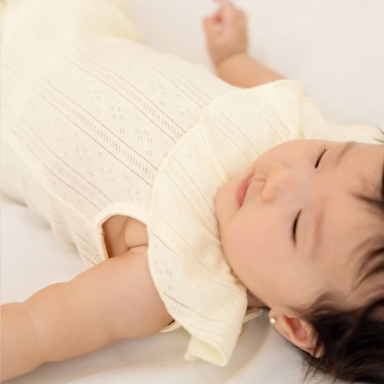 Baby Girl Ruffle Romper in Cream Pointelle Cotton